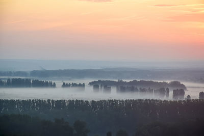 Scenic view of landscape against sky during sunset