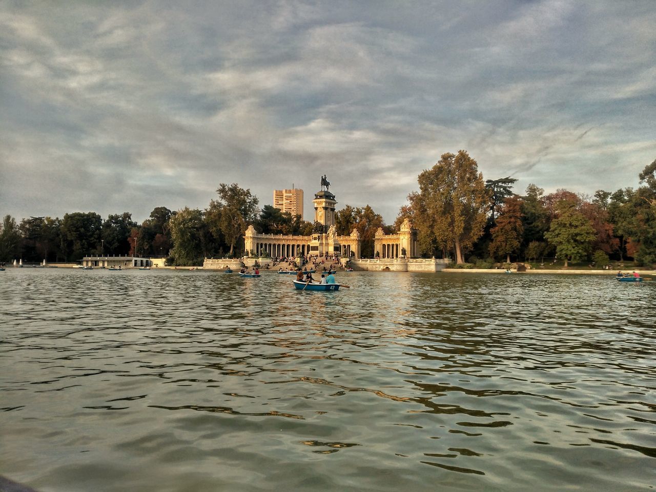 tree, water, nautical vessel, transportation, built structure, architecture, building exterior, sky, cloud - sky, mode of transport, travel destinations, waterfront, tourism, tranquility, cloudy, tranquil scene, outdoors, nature, day, history, town, vacations, famous place, scenics, no people