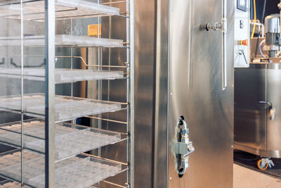 Shelving with molds for pouring chocolates. manufacturin for automatic production of chocolate. 