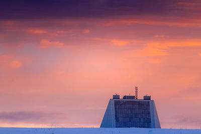 Low angle view of building against sky during sunset