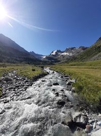 Scenic view of stream against clear sky
