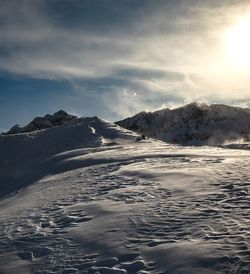 Scenic view of snowcapped mountains against sky