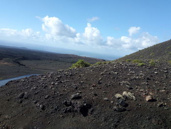 Scenic view of volcanic landscape against sky