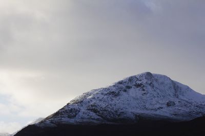 Low angle view of snow mountain against sky