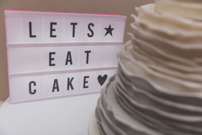 Close-up of text and cake 