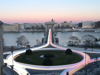 Bridge over river at sunset