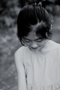 Cute girl looking down outdoors