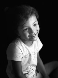 Portrait of a smiling girl looking away