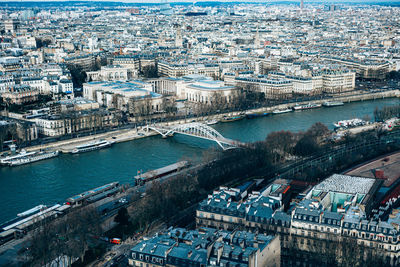 High angle view of river and buildings in city