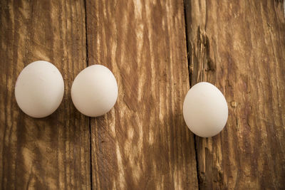 Close-up of eggs on wooden table