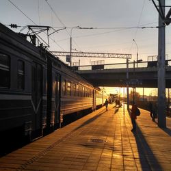 Train at railroad station against sky