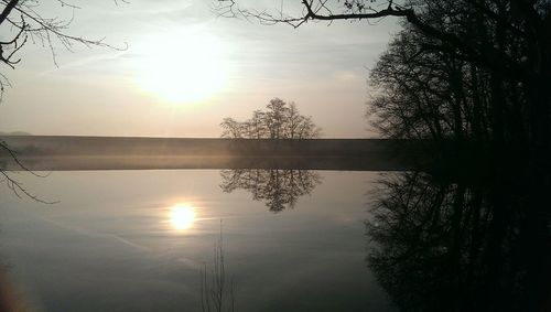 Scenic view of lake at sunset