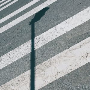 Shadow of street light zebra crossing