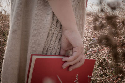 Close-up of woman hand holding book