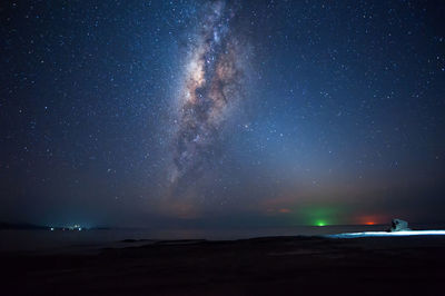 Scenic view of sea against sky at night