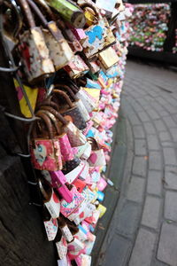 Close-up of clothes hanging on street at market stall