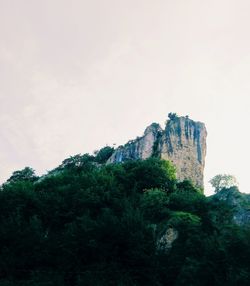 Low angle view of rock formations against sky