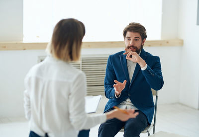 Psychiatrist consulting patient in hospital