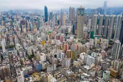 Aerial view of modern buildings in city against sky