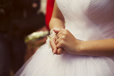 Close-up of couple holding hands