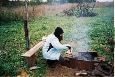 Roasting patatos in a self-made village bbq set