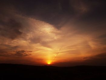 Scenic view of dramatic sky during sunset