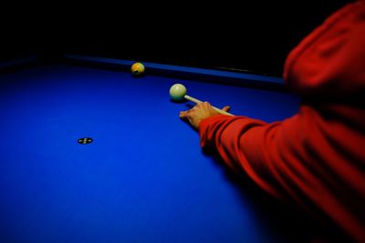 High angle view of man playing snooker