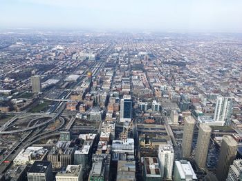 High angle view of modern buildings in city against sky