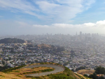 High angle view of buildings in city against sky