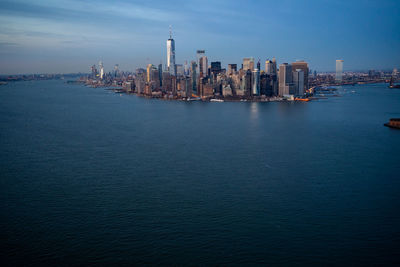 Aerial view of the lower manhattan in new york city as seen from a helicopter before the sunset