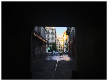 Road amidst buildings in city