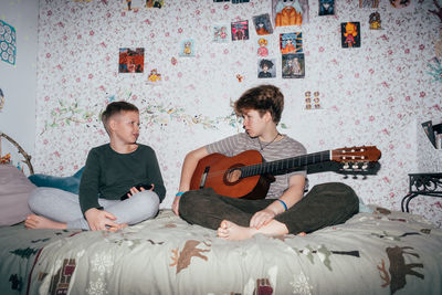 Sibling children communicate in the children's room, frontal flash.