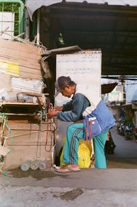 Side view of woman working