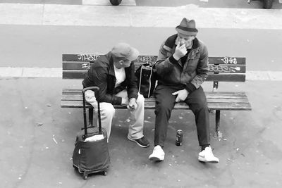 Men playing with umbrella