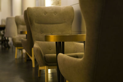 Empty chairs and tables in restaurant