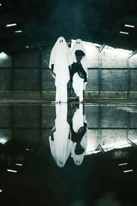 Low angle view of man standing in water