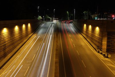 High angle view of light trails on road at night