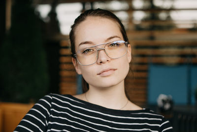 Close-up portrait of a smiling young woman