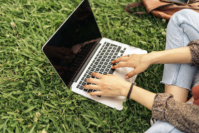 Close up of a muslim woman hands using a computer