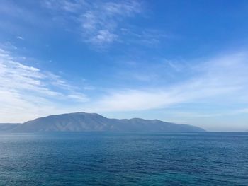 Scenic view of sea against blue sky