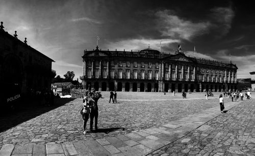 Tourists in front of historic building