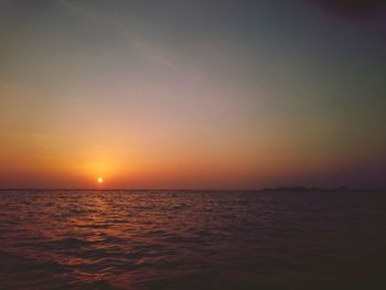 View of calm sea at sunset