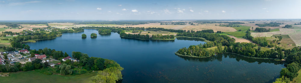 An aerial shot of a beautiful lake in the märkische schweiz nature park on a hot summers day.