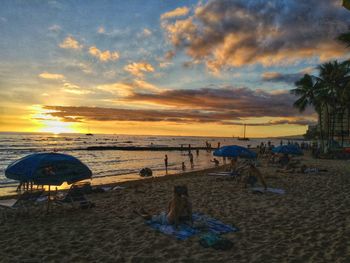 Scenic view of beach against sky during sunset