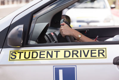 Close-up of man driving car