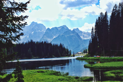 Scenic view of lake and mountains against sky