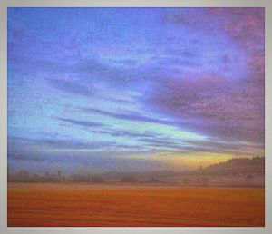 Scenic view of field against cloudy sky