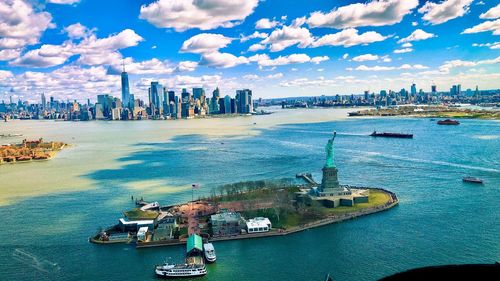 Panoramic view of sea and buildings against sky