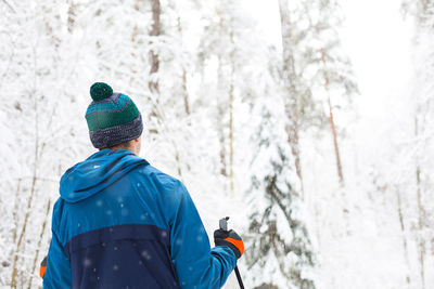 Rear view of man in snow