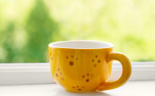 Close-up of coffee cup on table